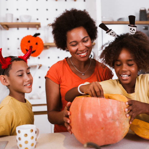 Family-carving-a-pumpkin.png