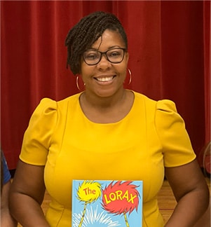 Woman holding up a book