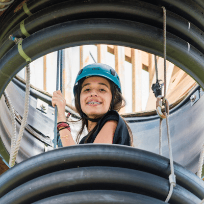 young girl smiling with helmet on