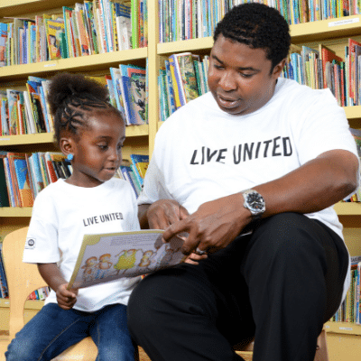 man and child reading