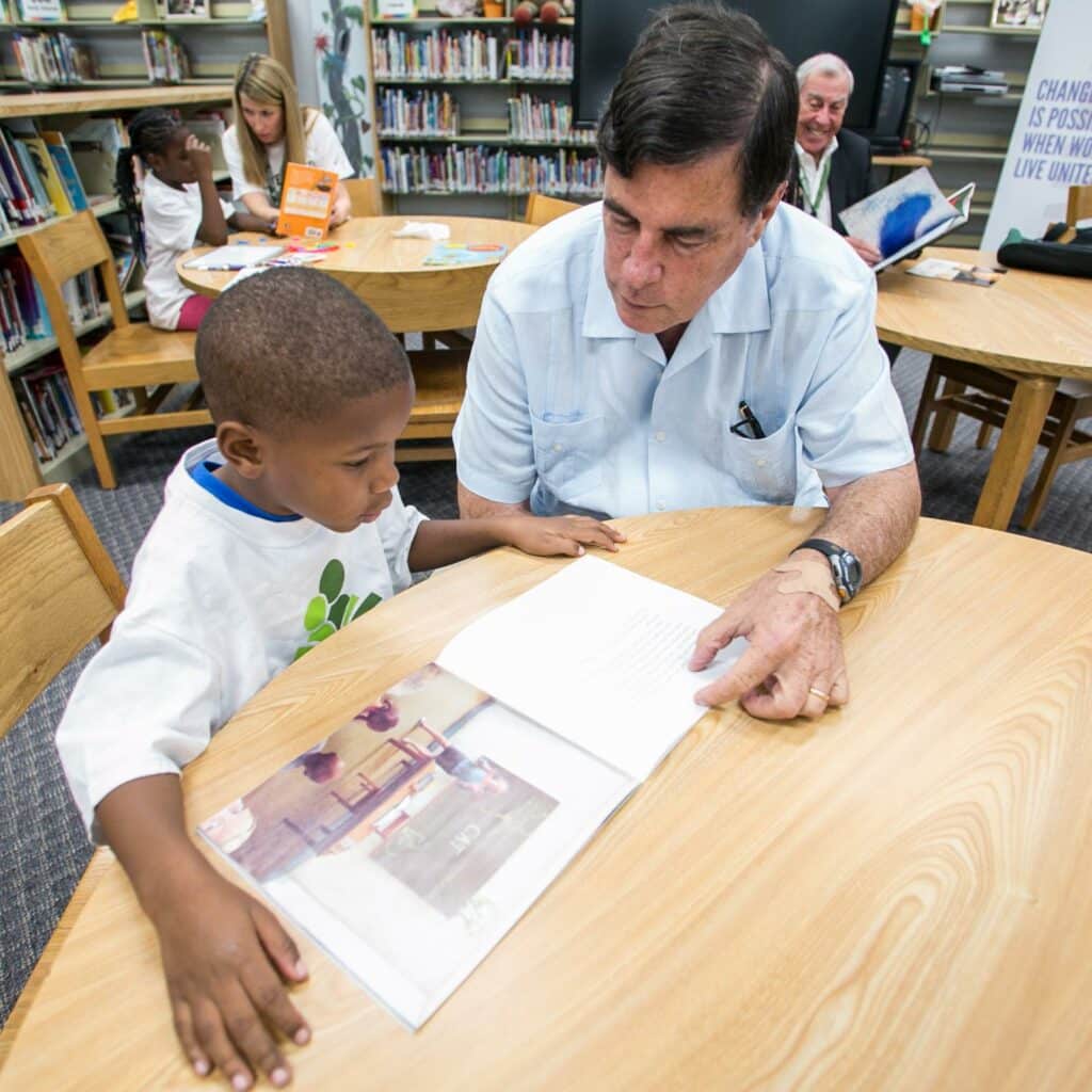 man reading with a child