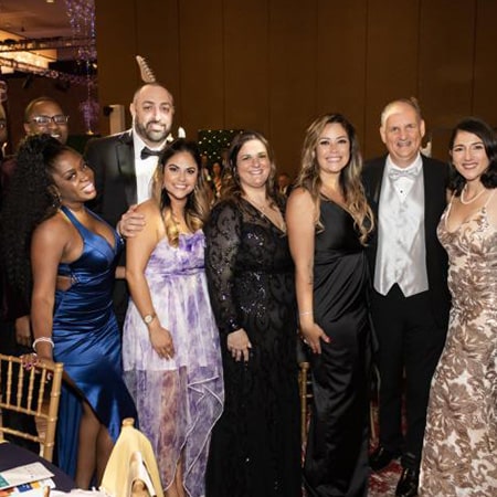 group in black tie at gala